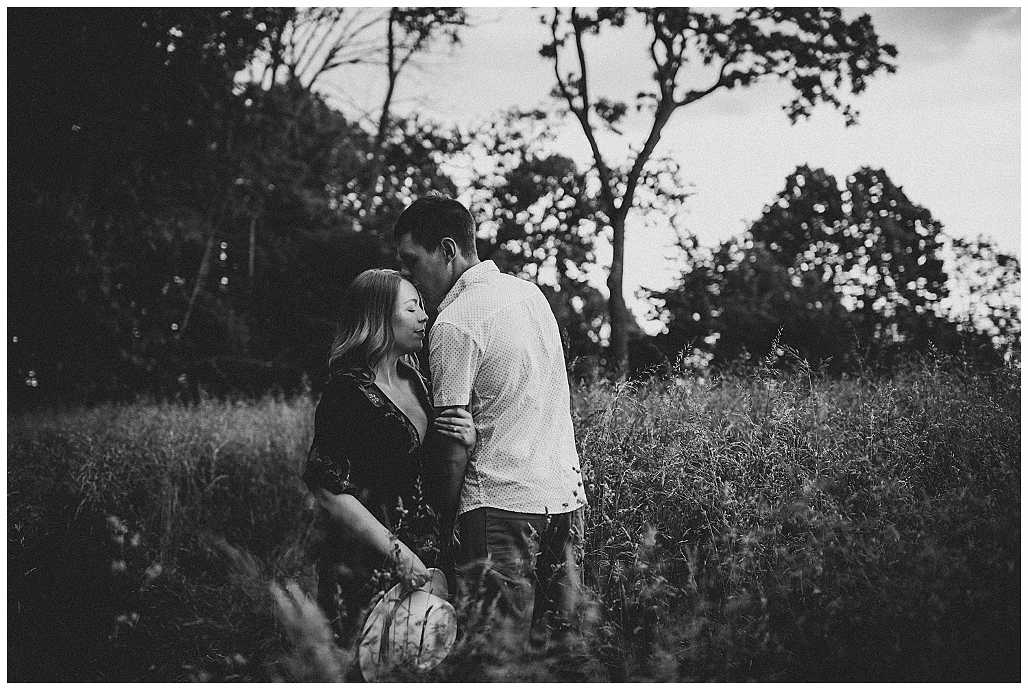 Husband kisses pregnant wife, family photography Southwest Virginia