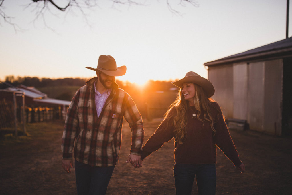 couples session on a farm during golden hour